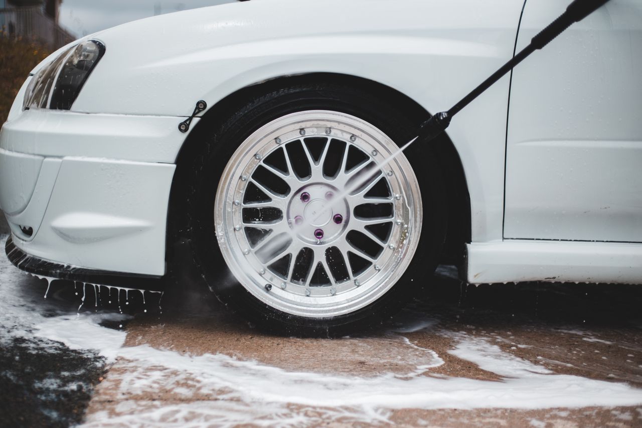 home-hero-bg Cleaning of wheel disk with water jet and soap from pressure washer gun
